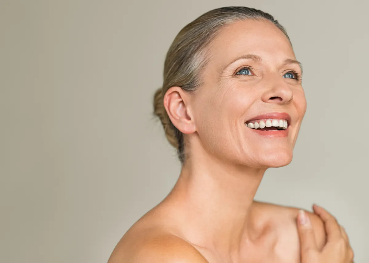Smiling woman with natural, healthy skin